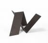 A minimalist sculpture featuring a dark, angular letter 'N' shape against a stark white background.