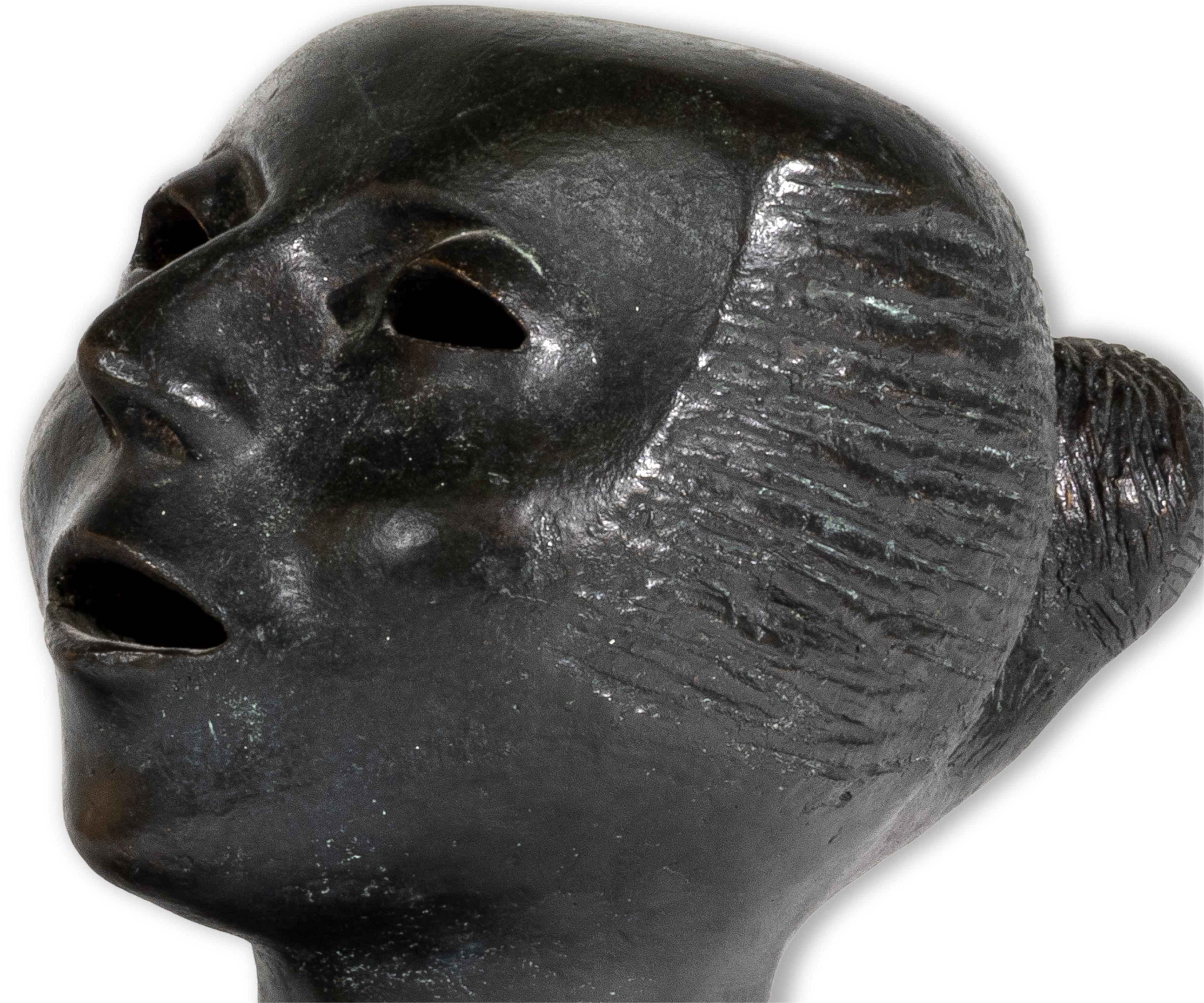 Artwork by Elizabeth Catlett, Cabeza Contando, Made of Bronze