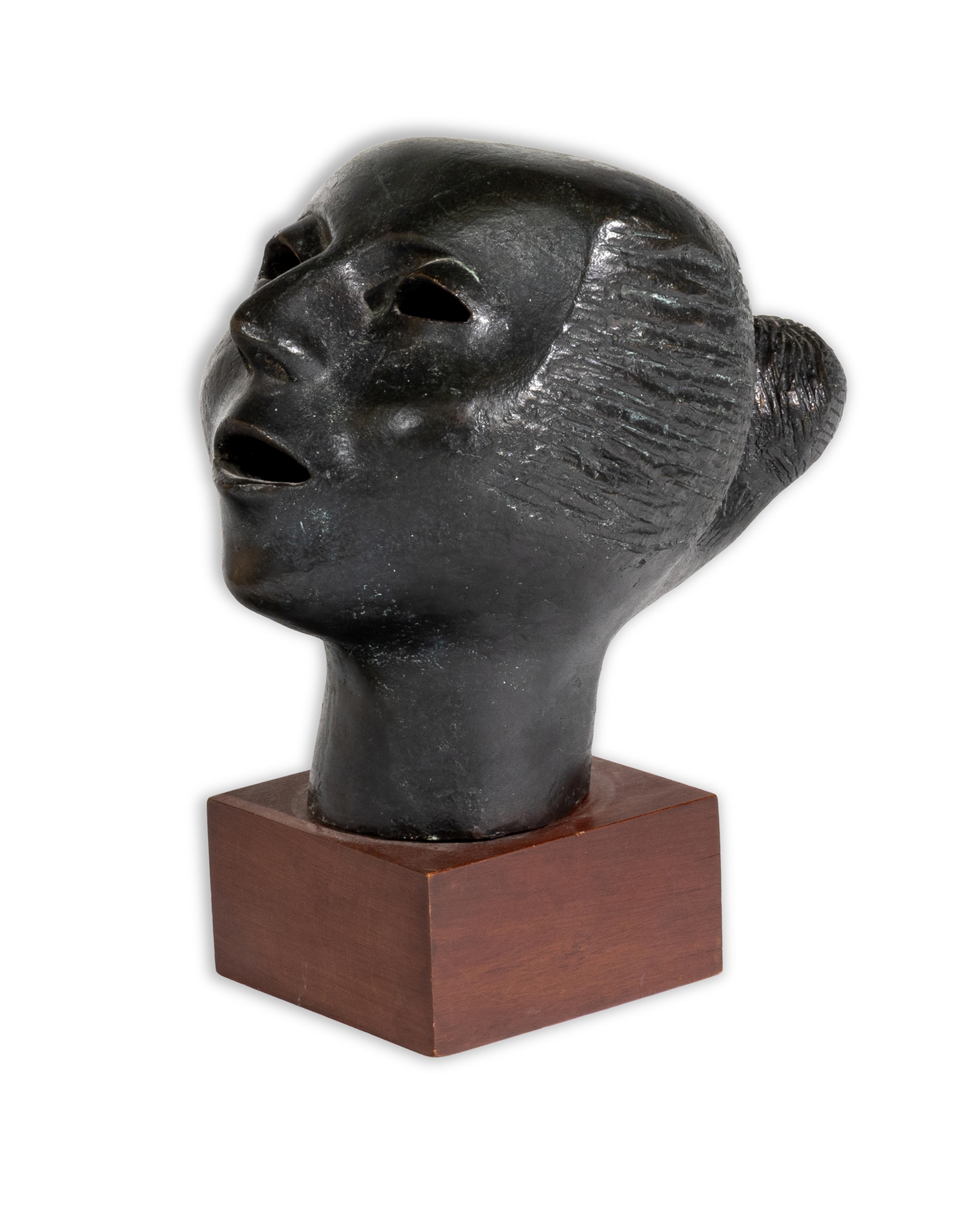 Artwork by Elizabeth Catlett, Cabeza Contando, Made of Bronze