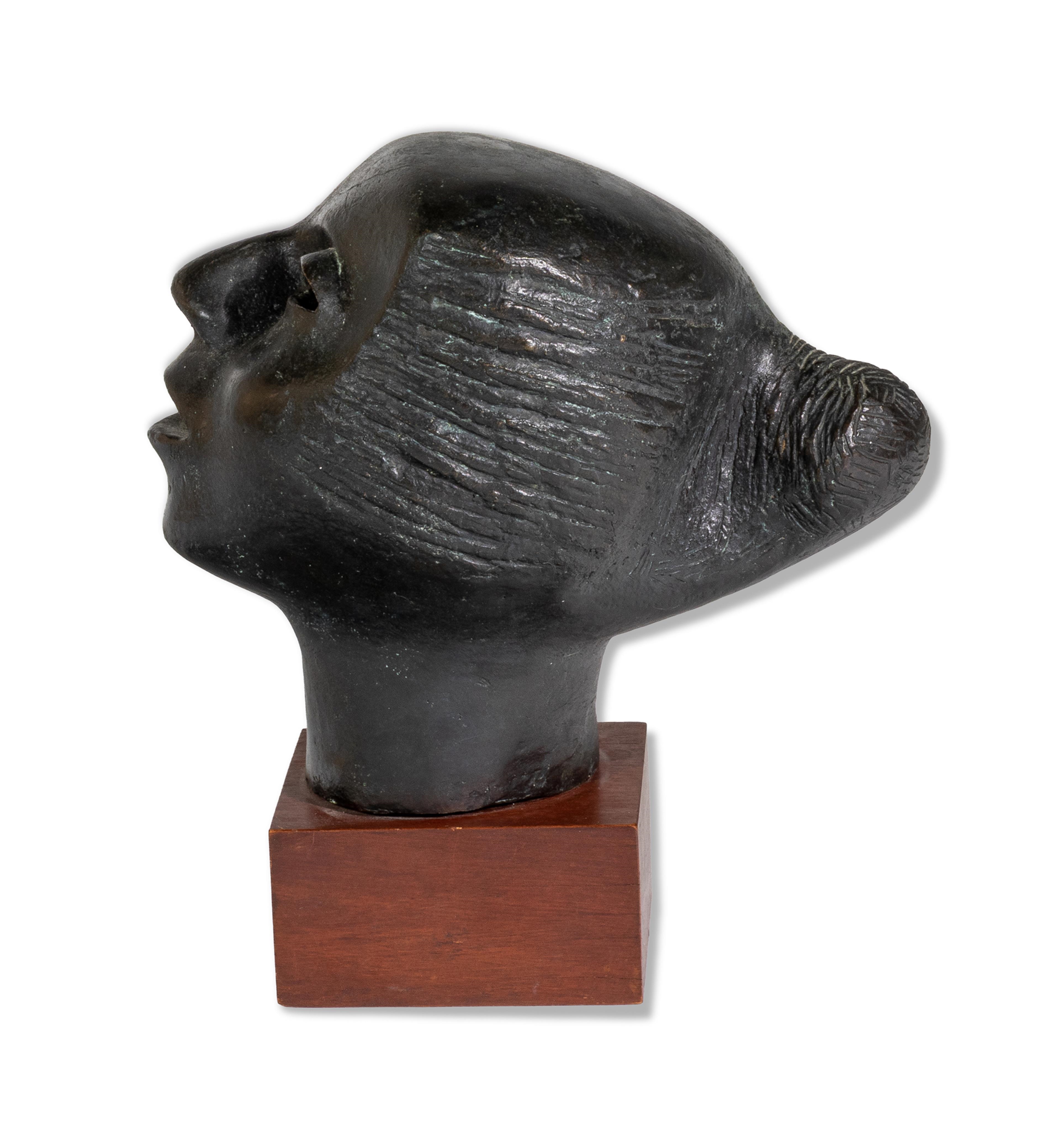 Artwork by Elizabeth Catlett, Cabeza Contando, Made of Bronze