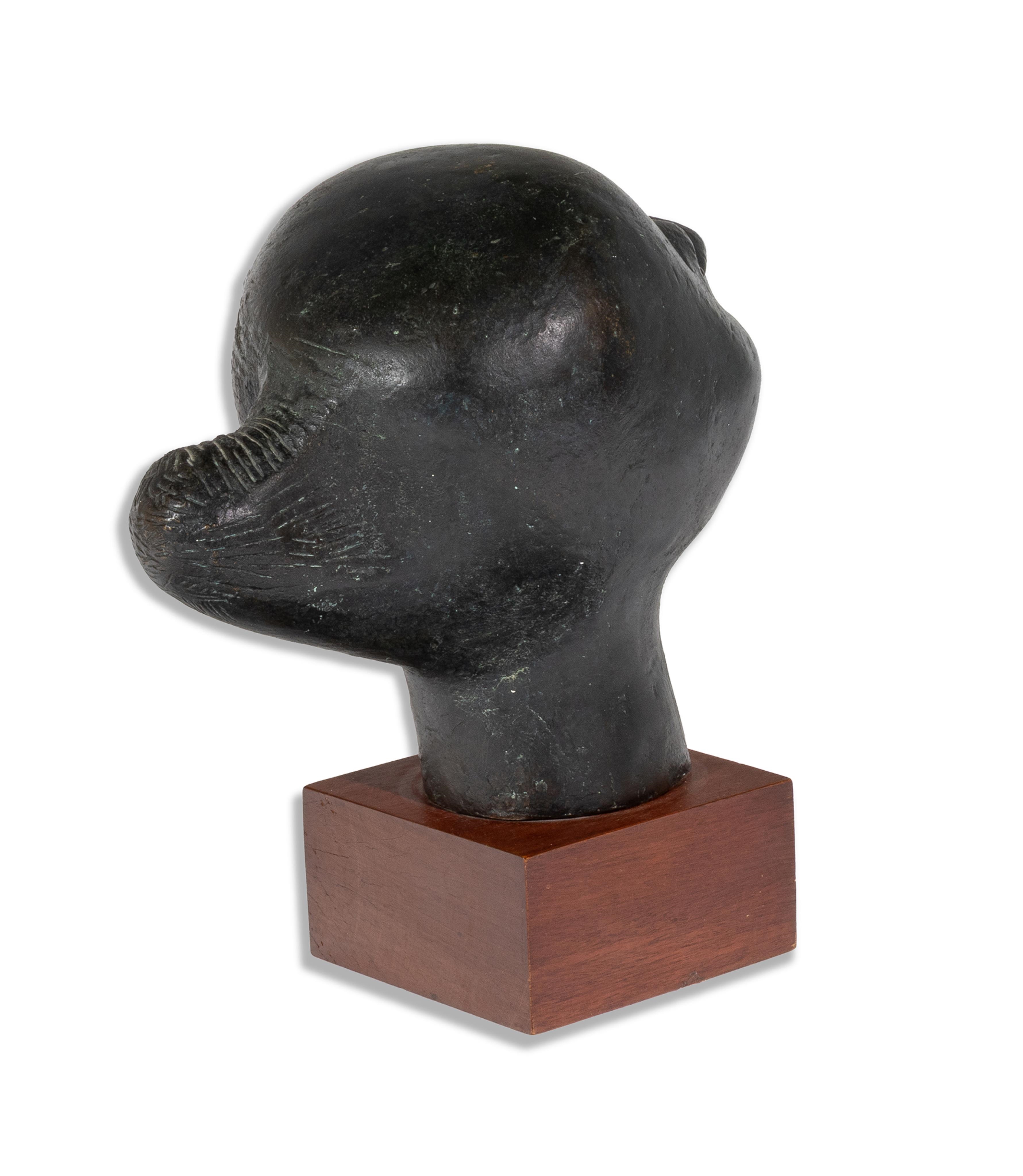 Artwork by Elizabeth Catlett, Cabeza Contando, Made of Bronze