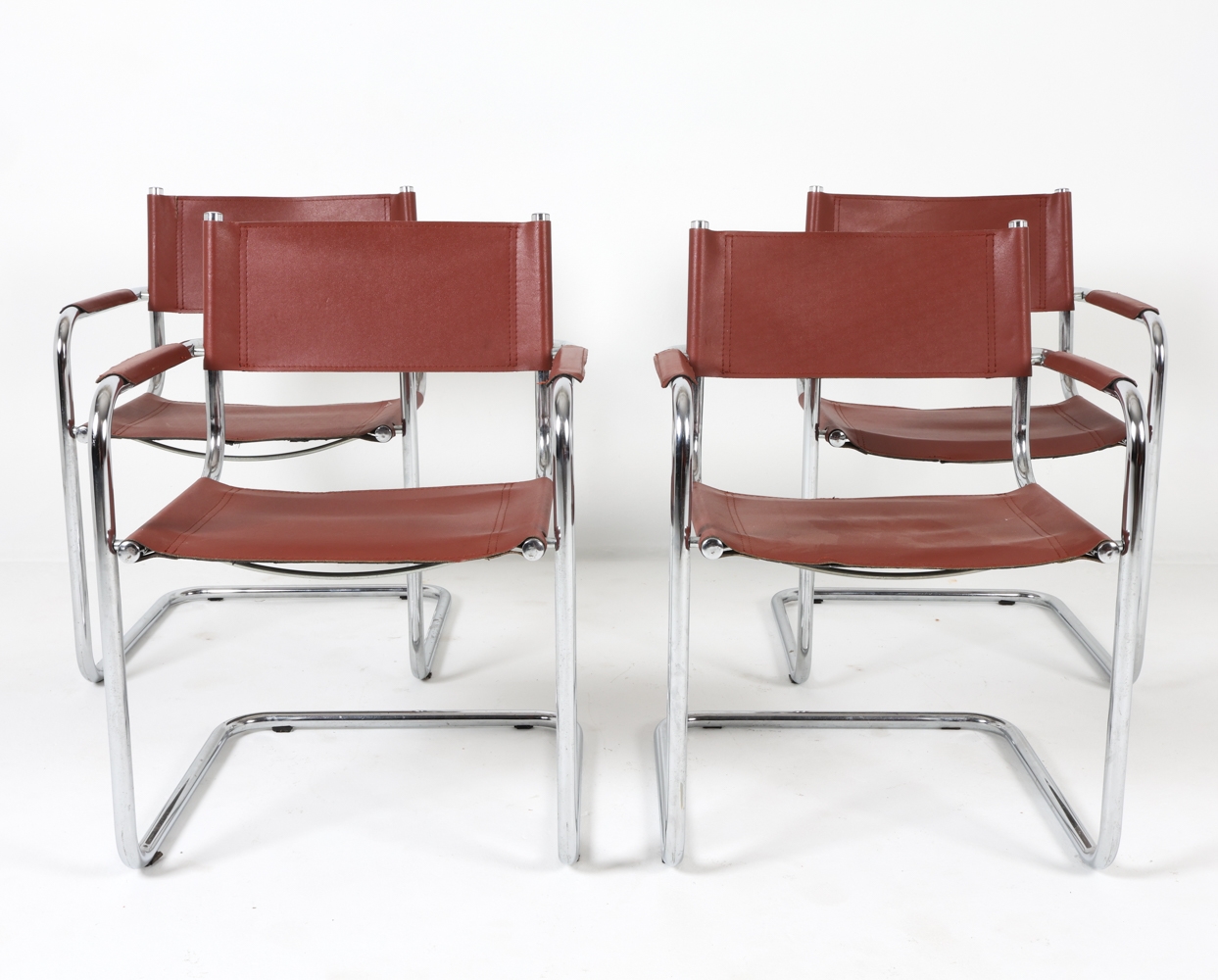Artwork by Mart Stam, Cantilever dining chairs, Made of Chrome steel with brown leather upholstery