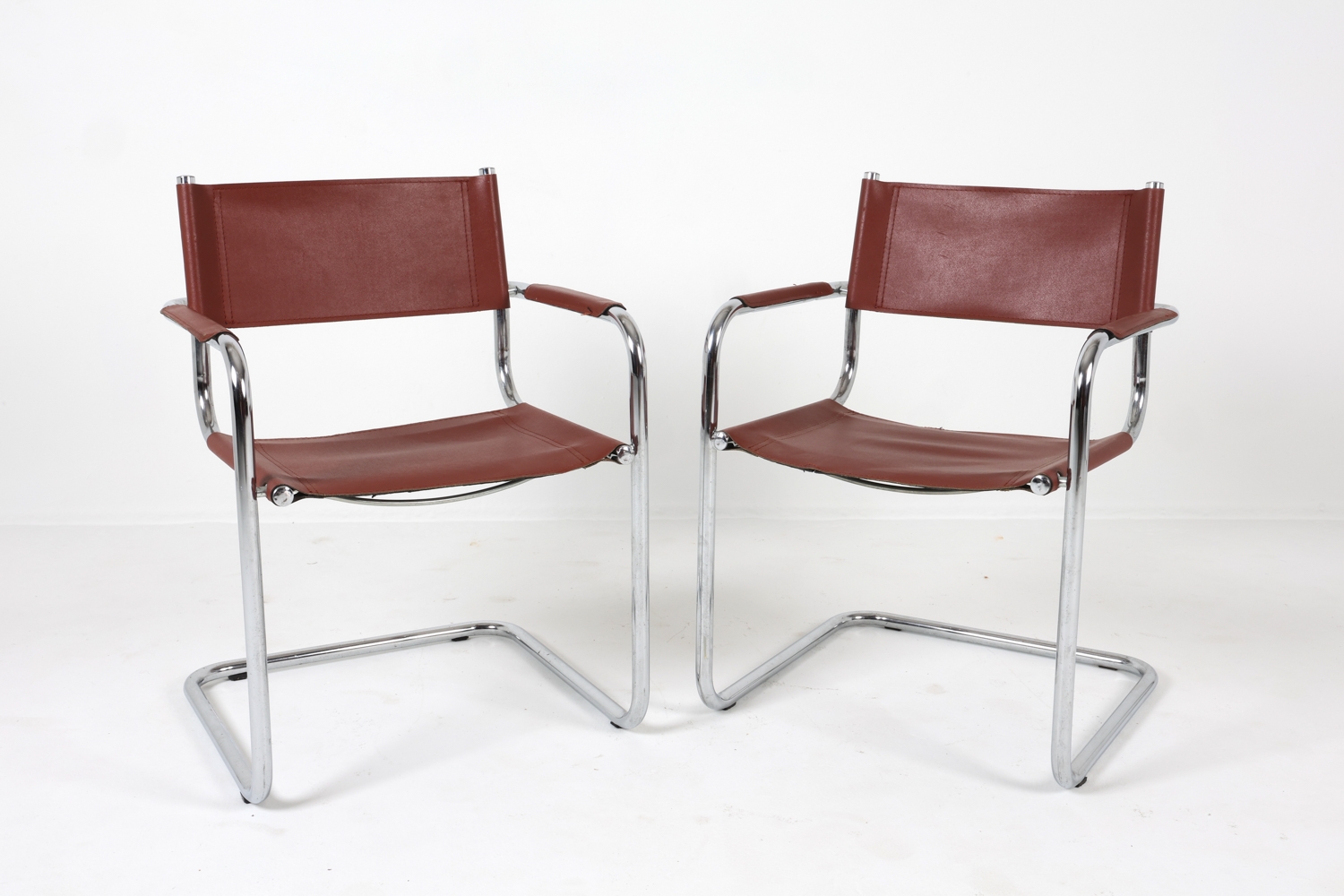 Artwork by Mart Stam, Cantilever dining chairs, Made of Chrome steel with brown leather upholstery