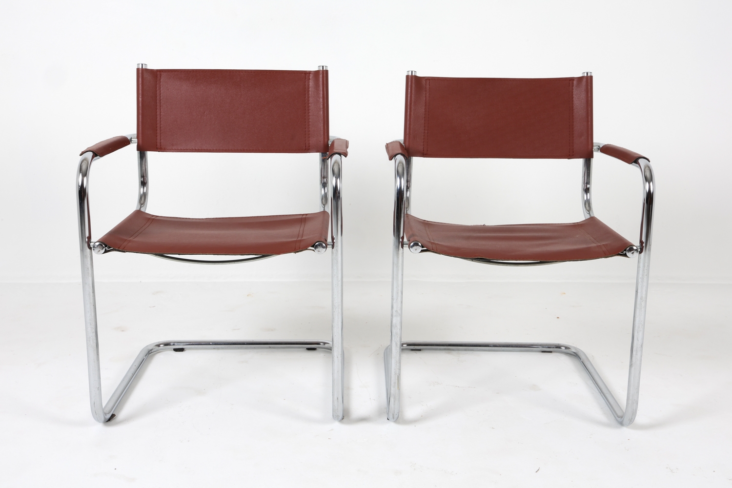Artwork by Mart Stam, Cantilever dining chairs, Made of Chrome steel with brown leather upholstery