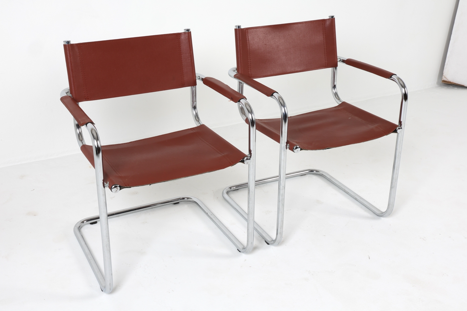 Artwork by Mart Stam, Cantilever dining chairs, Made of Chrome steel with brown leather upholstery