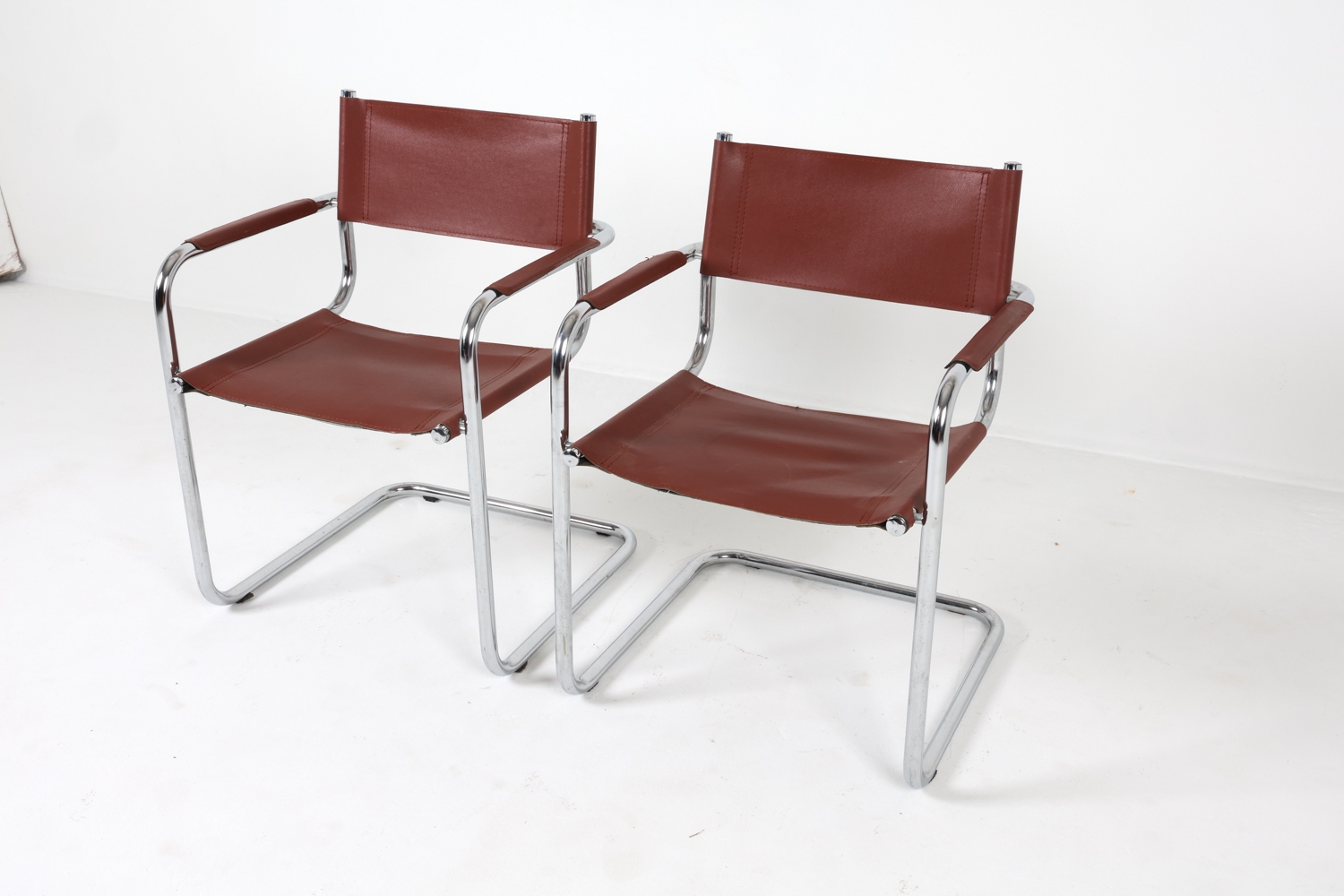 Artwork by Mart Stam, Cantilever dining chairs, Made of Chrome steel with brown leather upholstery