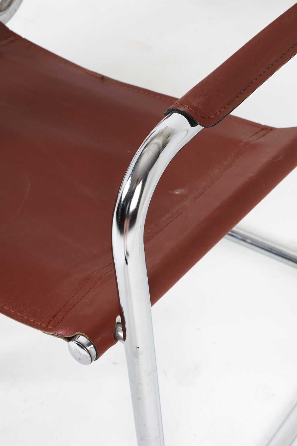 Artwork by Mart Stam, Cantilever dining chairs, Made of Chrome steel with brown leather upholstery