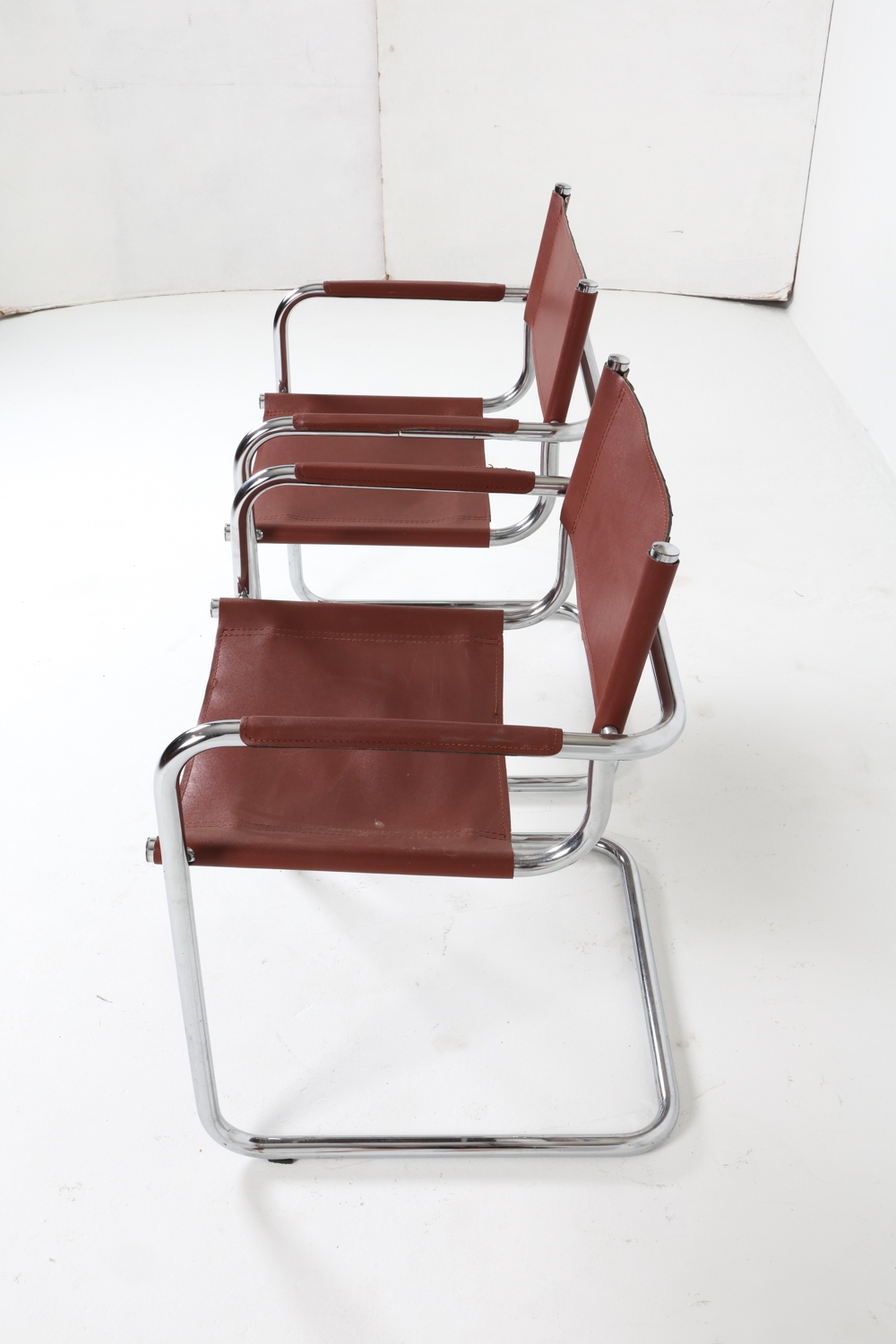 Artwork by Mart Stam, Cantilever dining chairs, Made of Chrome steel with brown leather upholstery
