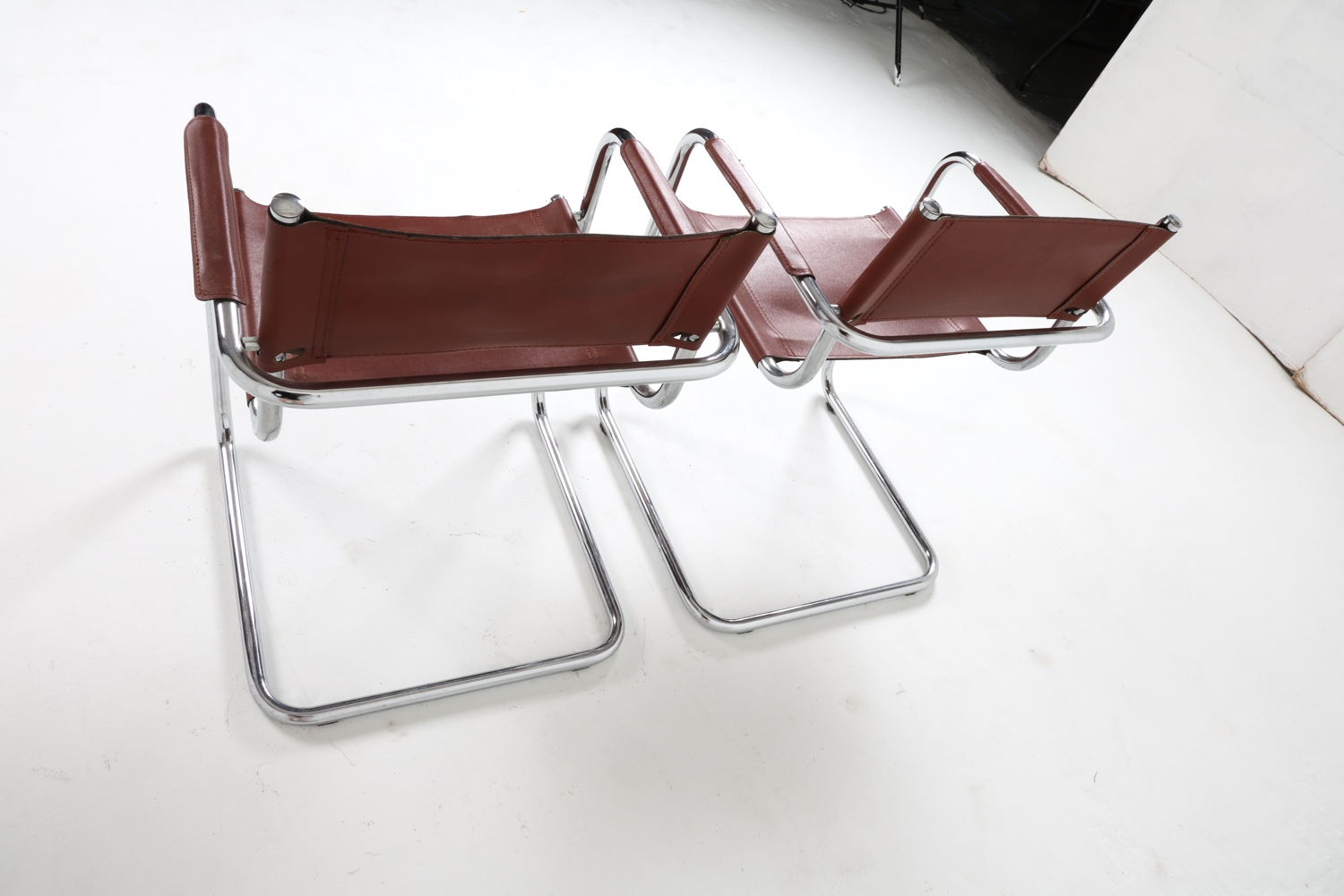 Artwork by Mart Stam, Cantilever dining chairs, Made of Chrome steel with brown leather upholstery