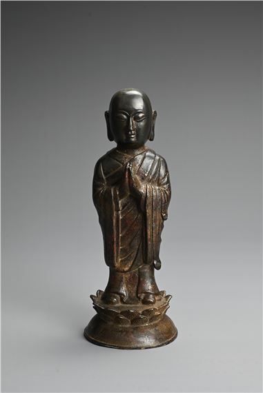 A CHINESE BRONZE FIGURE OF LUOHAN by Chinese School