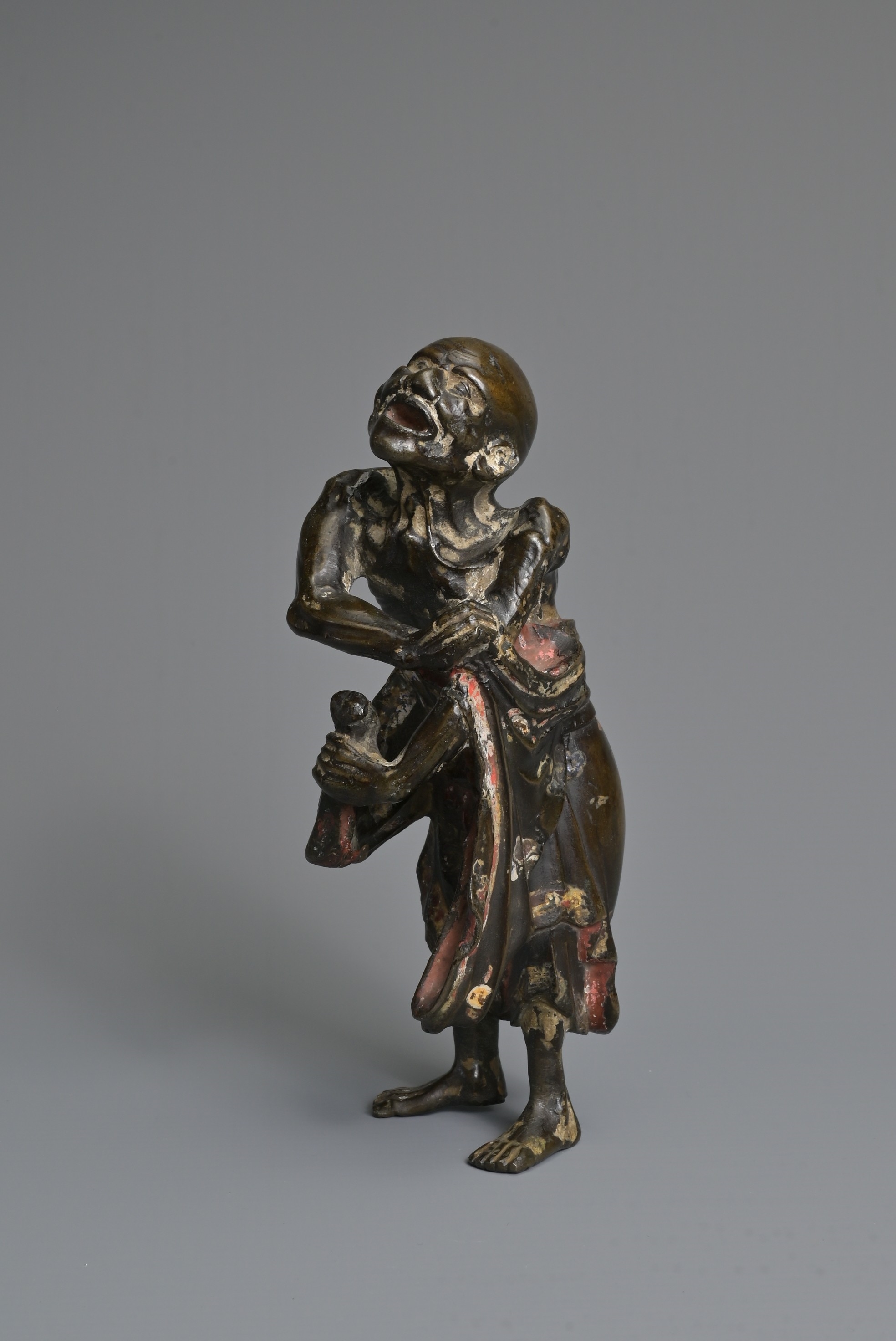 Artwork by Chinese School, A CHINESE HEAVILY CAST BRONZE MODEL OF A LUOHAN, Made of Bronze