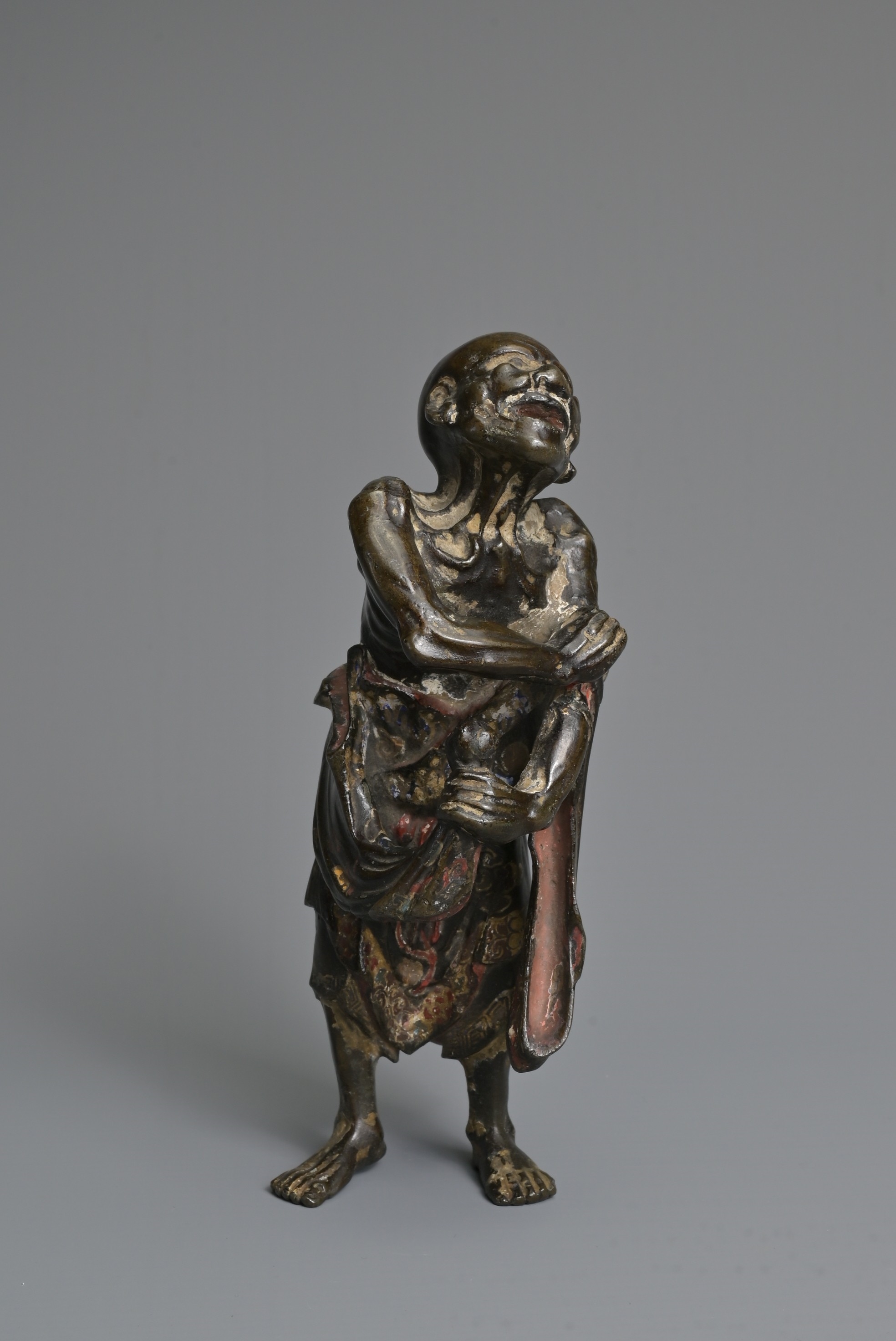 Artwork by Chinese School, A CHINESE HEAVILY CAST BRONZE MODEL OF A LUOHAN, Made of Bronze