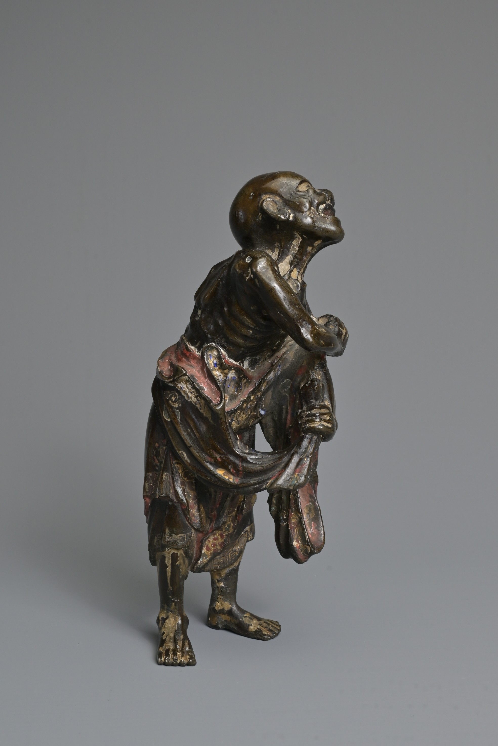 Artwork by Chinese School, A CHINESE HEAVILY CAST BRONZE MODEL OF A LUOHAN, Made of Bronze