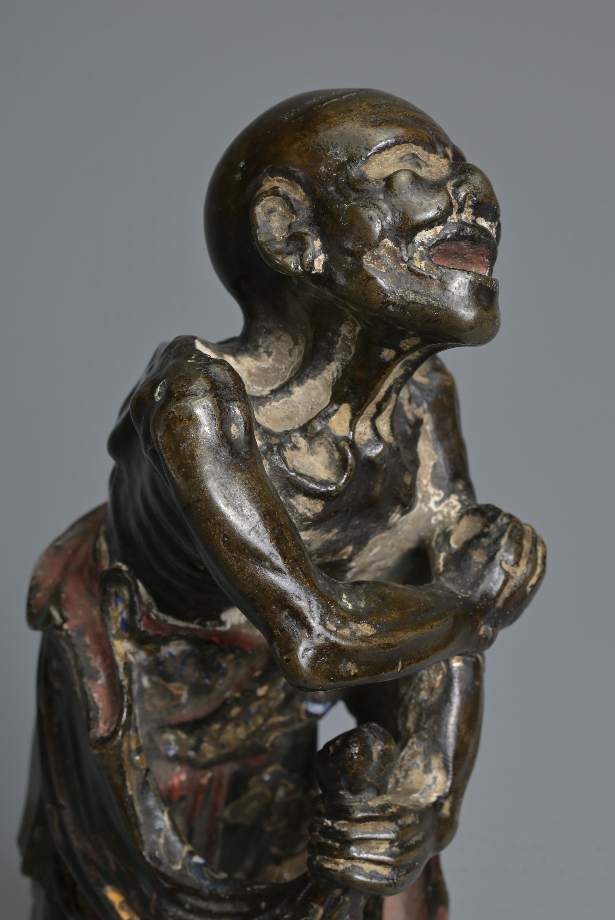 Artwork by Chinese School, A CHINESE HEAVILY CAST BRONZE MODEL OF A LUOHAN, Made of Bronze