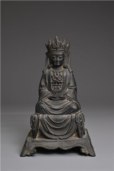 A CHINESE BRONZE FIGURE OF GUANYIN by Chinese School