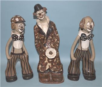 a studio pottery clown holding a flower - Elizabeth Haslam