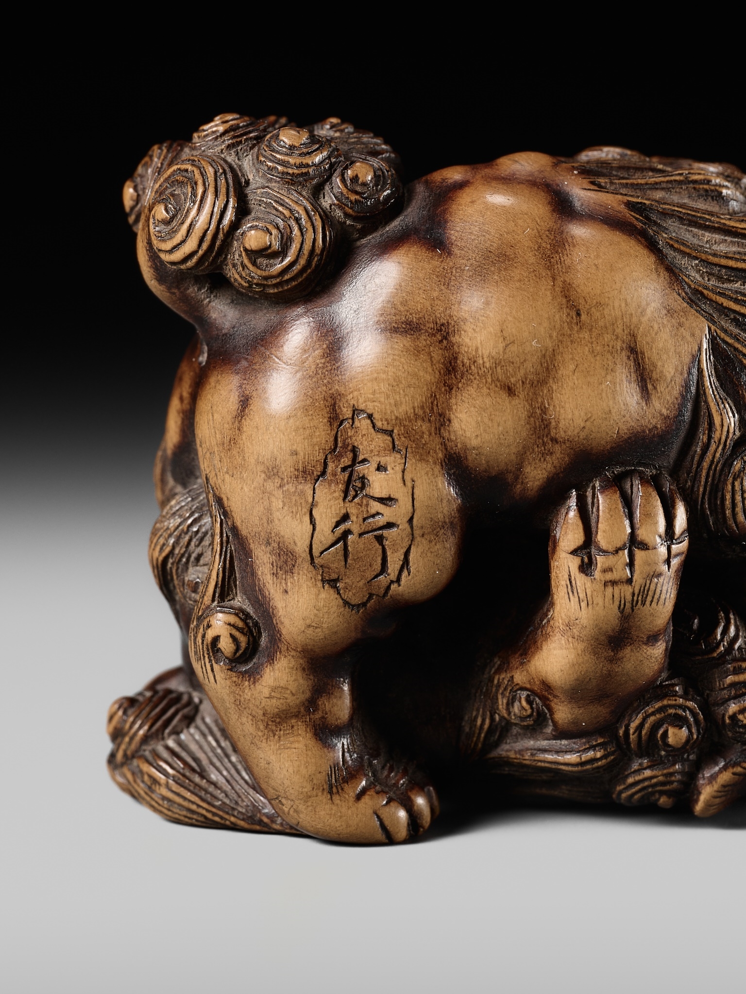 Artwork by Tomoyuki Tanaka, A LARGE AND POWERFUL WOOD NETSUKE OF TWO SHISHI, Made of Wood