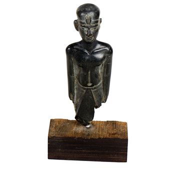 An ancient Egyptian carved basalt figure of a Pharaoh - Egyptian School 17th Century