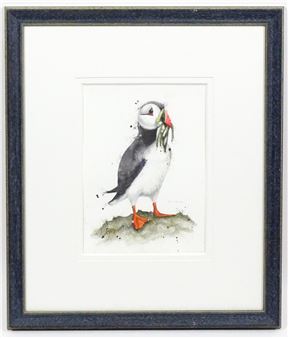 A puffin with fish in its beak - Sam Harvey