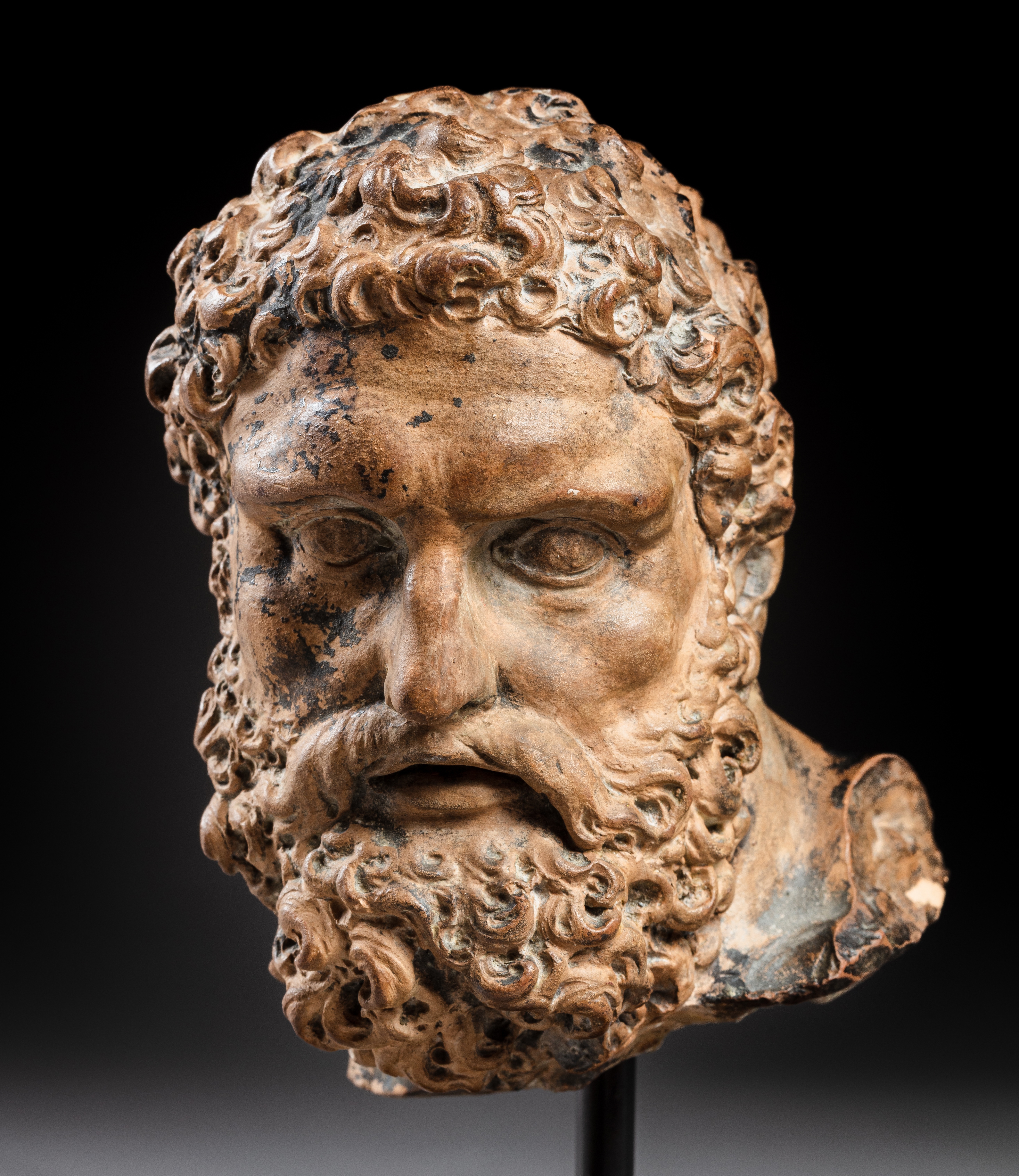 Artwork by Roman School, 17th Century, Head of the Farnese Hercules, Made of terracotta, bronze patina, on a later wood base