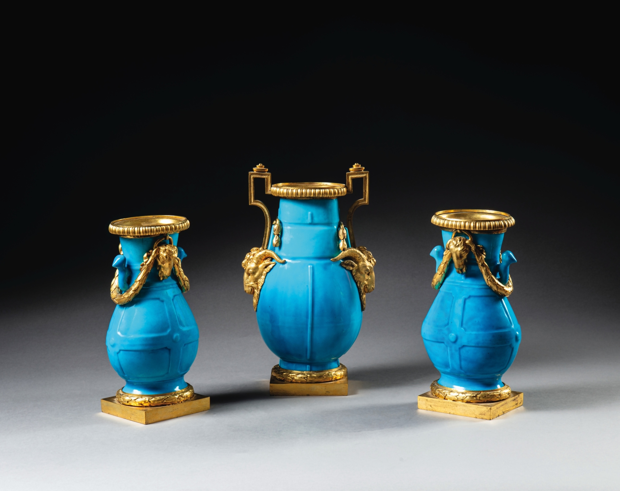 Artwork by Jean Dulac, A Louis XV gilt-bronze mounted Sèvres celestial blue porcelain garniture, circa 1765, mounts attributed to Jean Dulac, Made of Bronzes