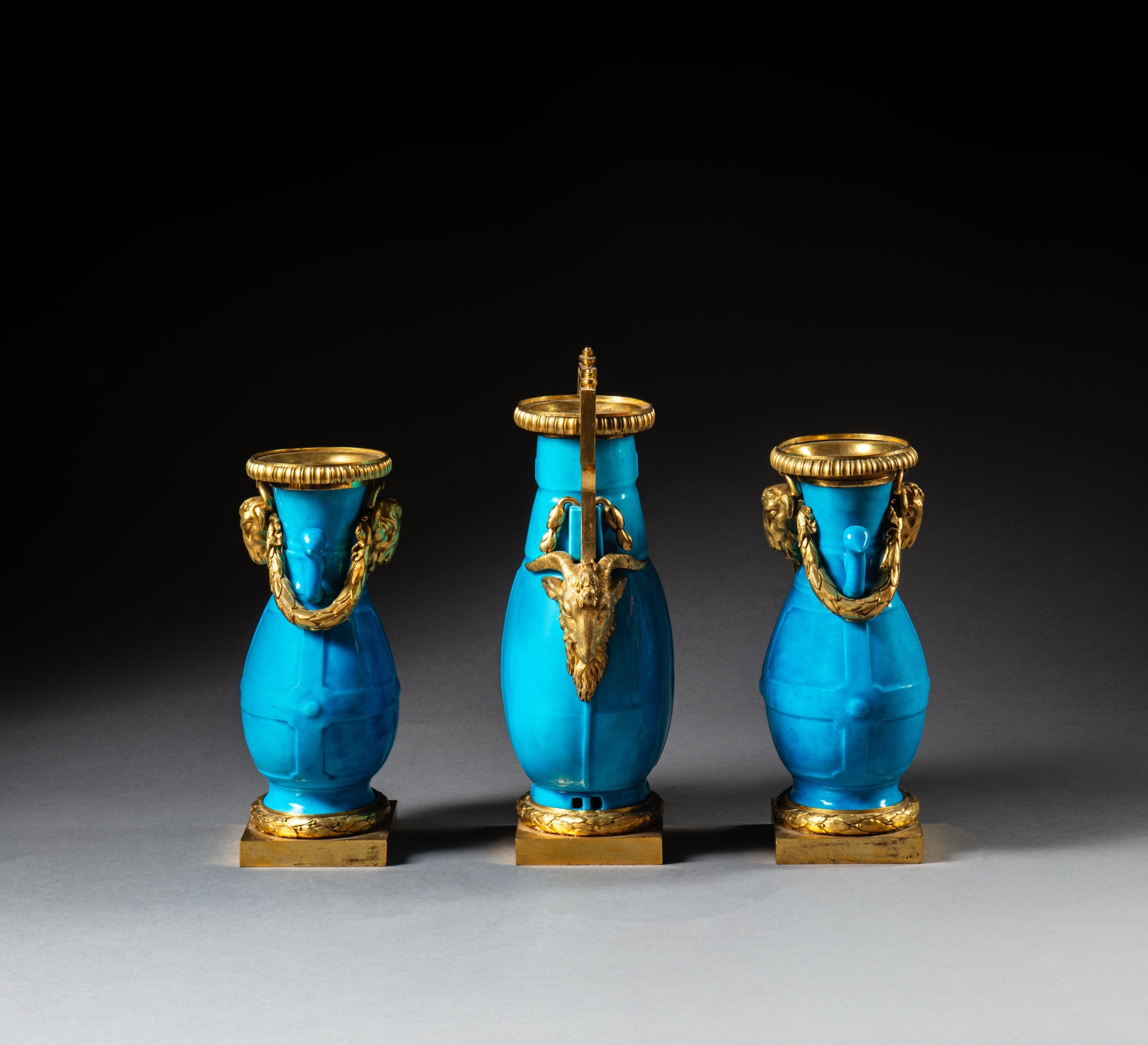 Artwork by Jean Dulac, A Louis XV gilt-bronze mounted Sèvres celestial blue porcelain garniture, circa 1765, mounts attributed to Jean Dulac, Made of Bronzes