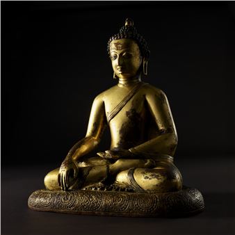 A GILT COPPER FIGURE OF SHAKYAMUNI BUDDHA