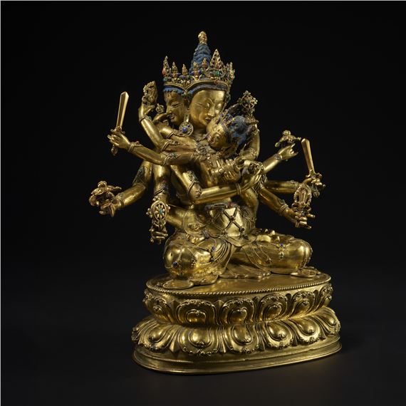 A GILT COPPER ALLOY FIGURE OF AKSHOBHYAVAJRA GUHYASAMAJA ATTRIBUTABLE TO SONAM GYALTSEN - Tibetan School, 15th Century