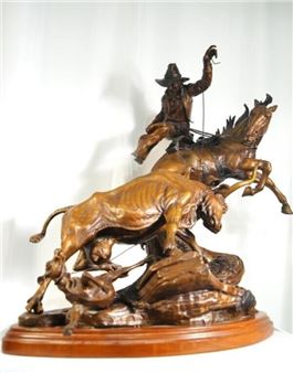 A dynamic bronze sculpture capturing a dramatic rodeo scene with a rider, horse, and bull.
