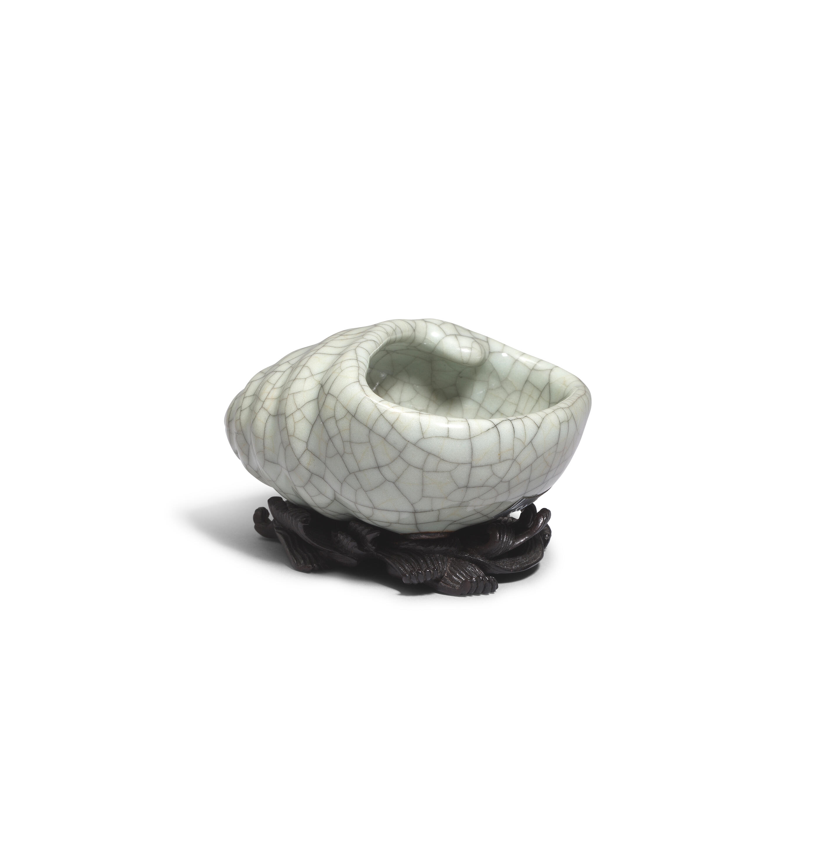 Artwork by Chinese School, A rare Ge-Type Tripod Conch-shaped Waterpot, Made of Naturalistically moulded in the form of a tapering shell with a large oval mouth, covered in a greyish sea-green glaze with fine grey craquelure save the three feet in the form of smaller swirling conches, glazed mother-of-pearl washer