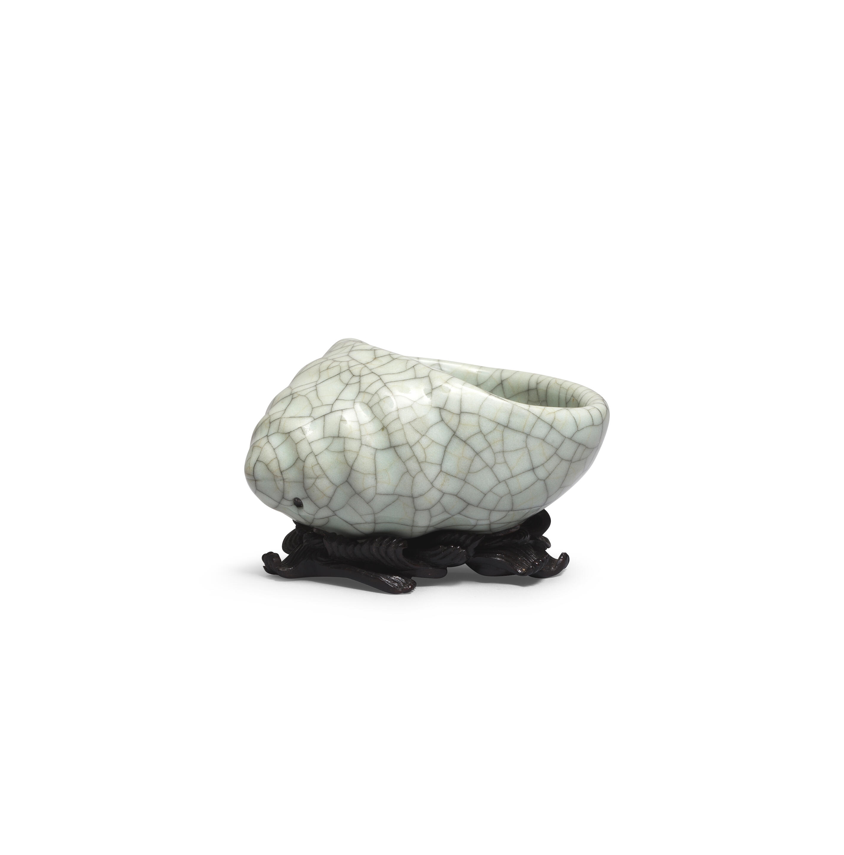 Artwork by Chinese School, A rare Ge-Type Tripod Conch-shaped Waterpot, Made of Naturalistically moulded in the form of a tapering shell with a large oval mouth, covered in a greyish sea-green glaze with fine grey craquelure save the three feet in the form of smaller swirling conches, glazed mother-of-pearl washer