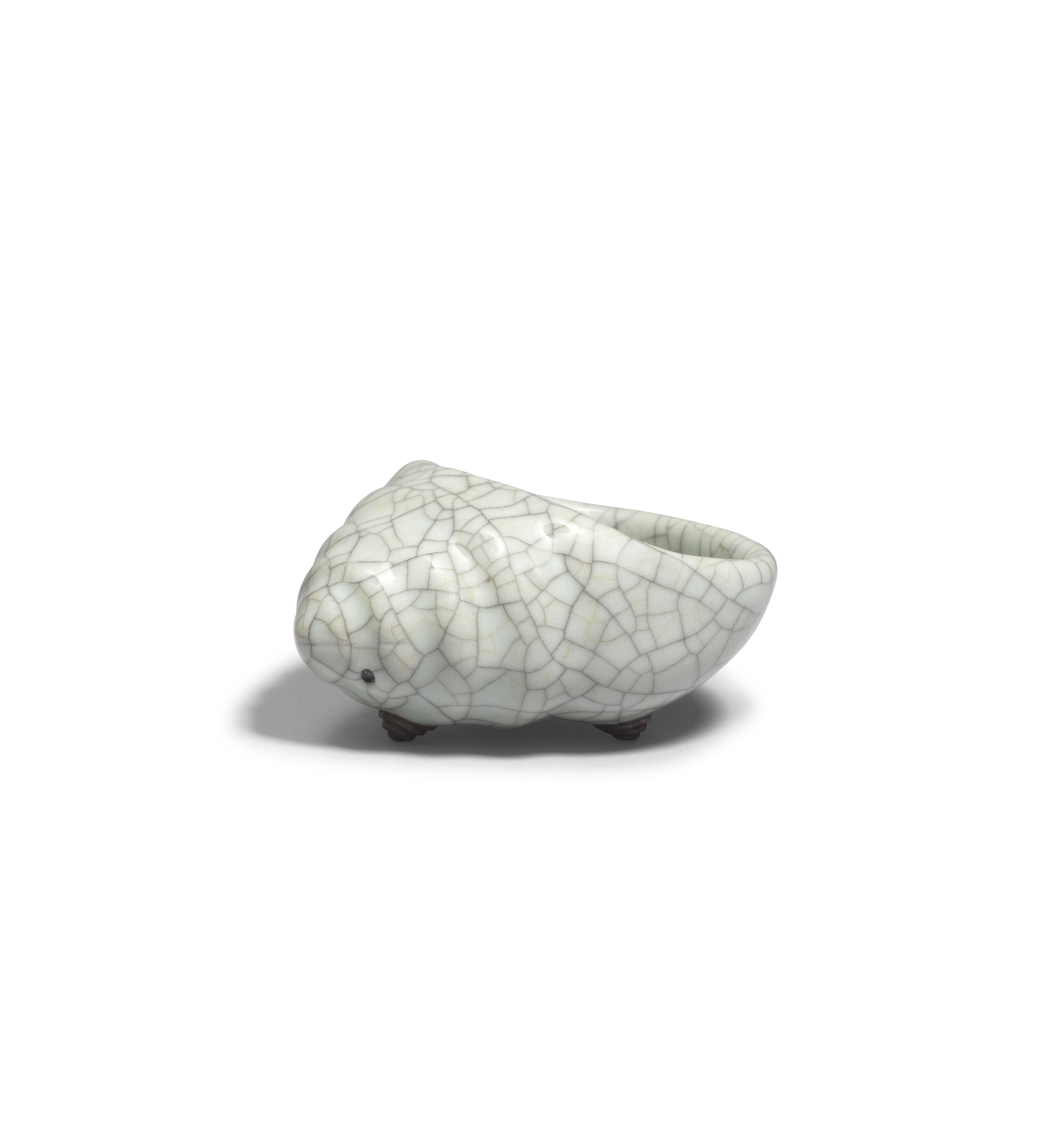 Artwork by Chinese School, A rare Ge-Type Tripod Conch-shaped Waterpot, Made of Naturalistically moulded in the form of a tapering shell with a large oval mouth, covered in a greyish sea-green glaze with fine grey craquelure save the three feet in the form of smaller swirling conches, glazed mother-of-pearl washer