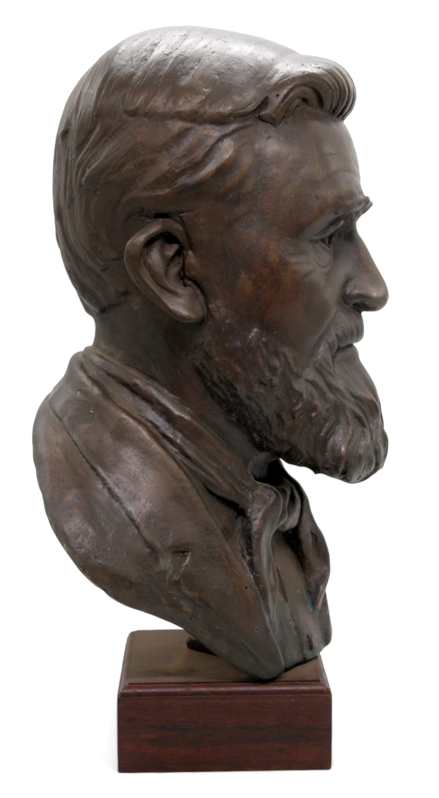 A bronze bust of a bearded man with a solemn expression, mounted on a dark rectangular base.