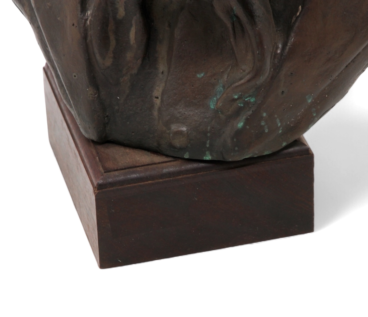 A bronze bust of a bearded man with a solemn expression, mounted on a dark rectangular base.