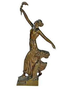 A partially draped female figure holding a torch aloft - B. V. Fernandez