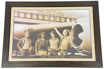 The band in front of their private jet - Bob Gruen