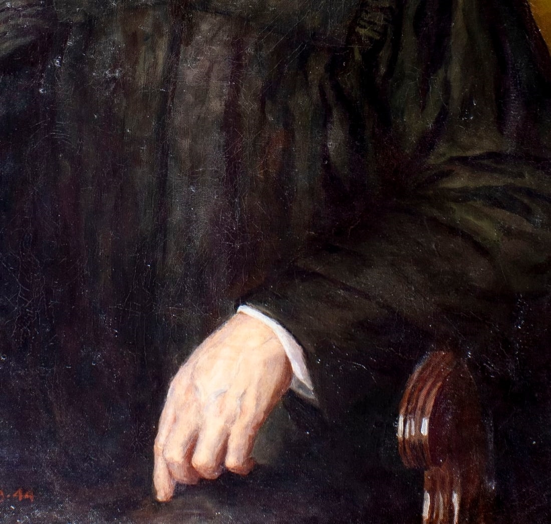 A formal portrait of a seated figure in judicial robes against a muted green background.