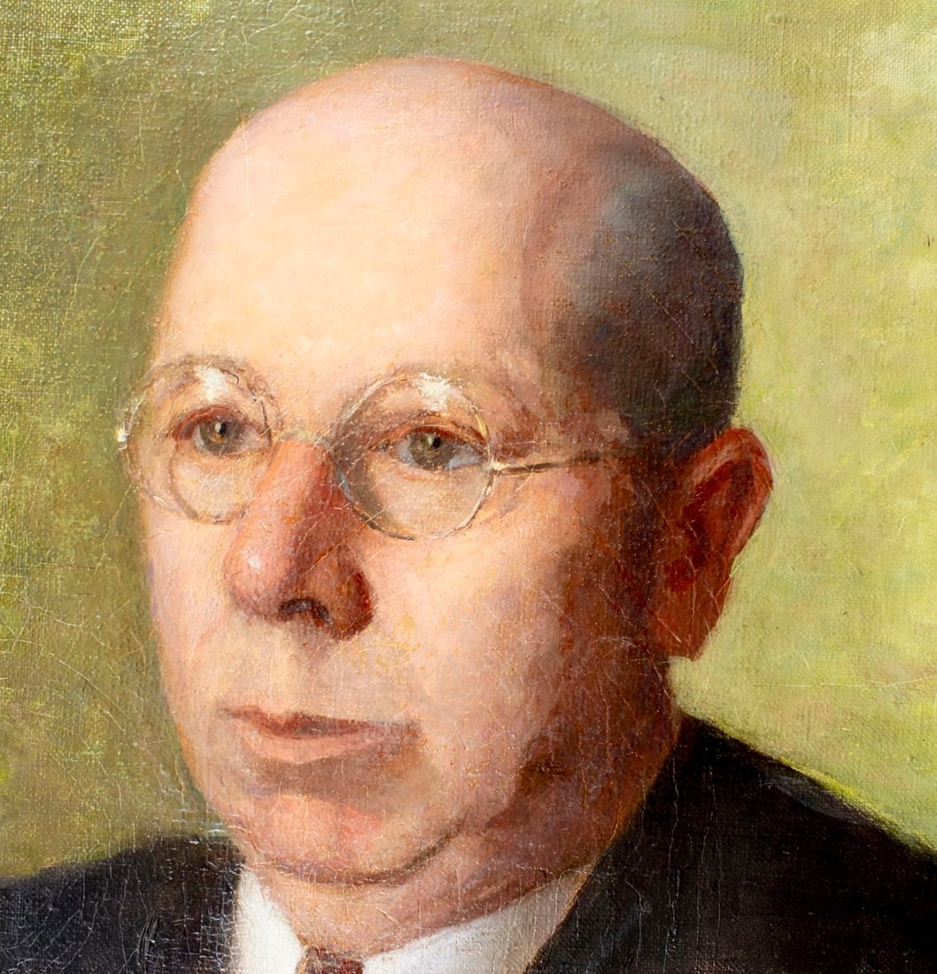 A formal portrait of a seated figure in judicial robes against a muted green background.