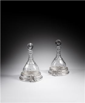 A pair of George II bottle/decanter stands - Paul Crespin