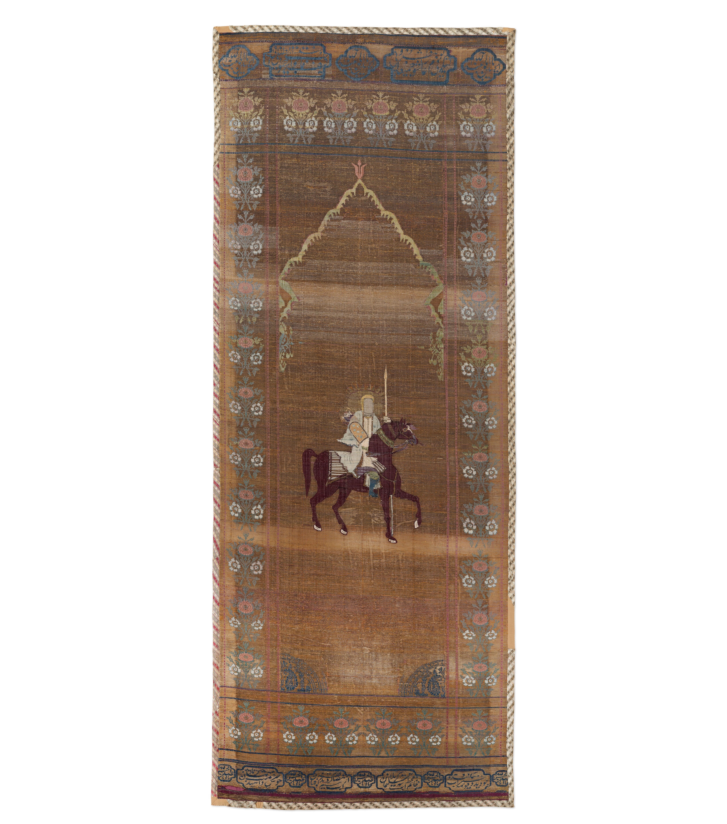 Artwork by Persian School, 19th Century, An impressive Qajar for Ashura day celebrations, Made of Rectangular form, woven and embroidered in polychrome silk and metal thread with the Imam Husayn mounted on horseback carrying a shield and lance, the head and upper body of a child behind him, spandrels above, the border with a repeat design of floral sprays, above and below bands of inscription-filled cartouches, woven silk edging