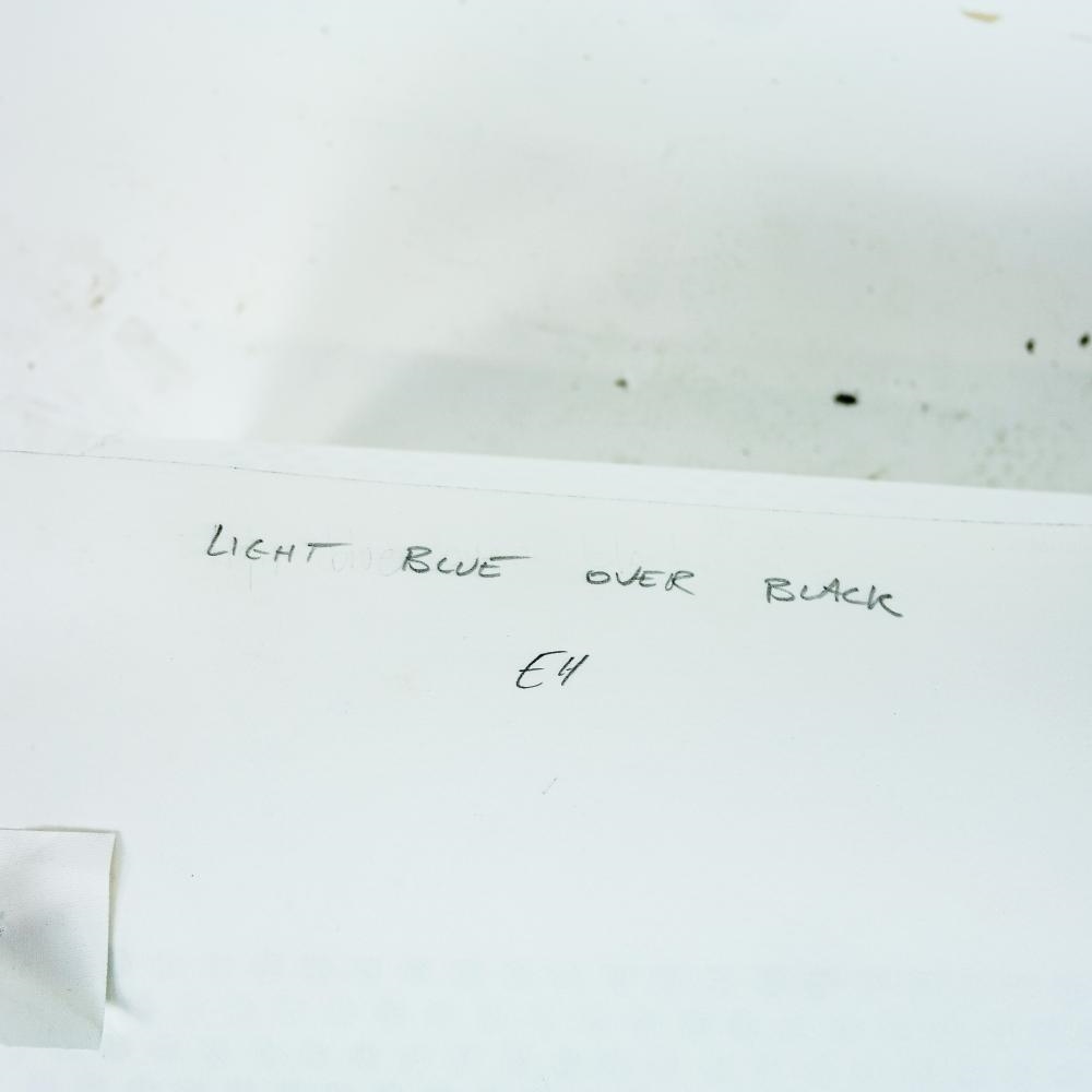 Artwork by Evan Holloway, Light Blue Over Black, Made of Mixed Media Print On Paper With Metal Grate