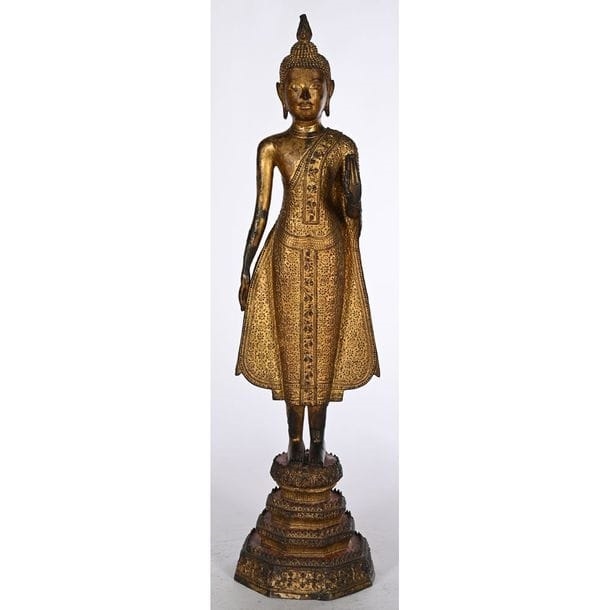 Artwork by Thai School, 19th Century, STATUE OF A STANDING BUDDHA in gilded and patinated bronze, Made of gilded and patinated bronze
