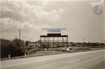 A black and white photo of an empty highway.