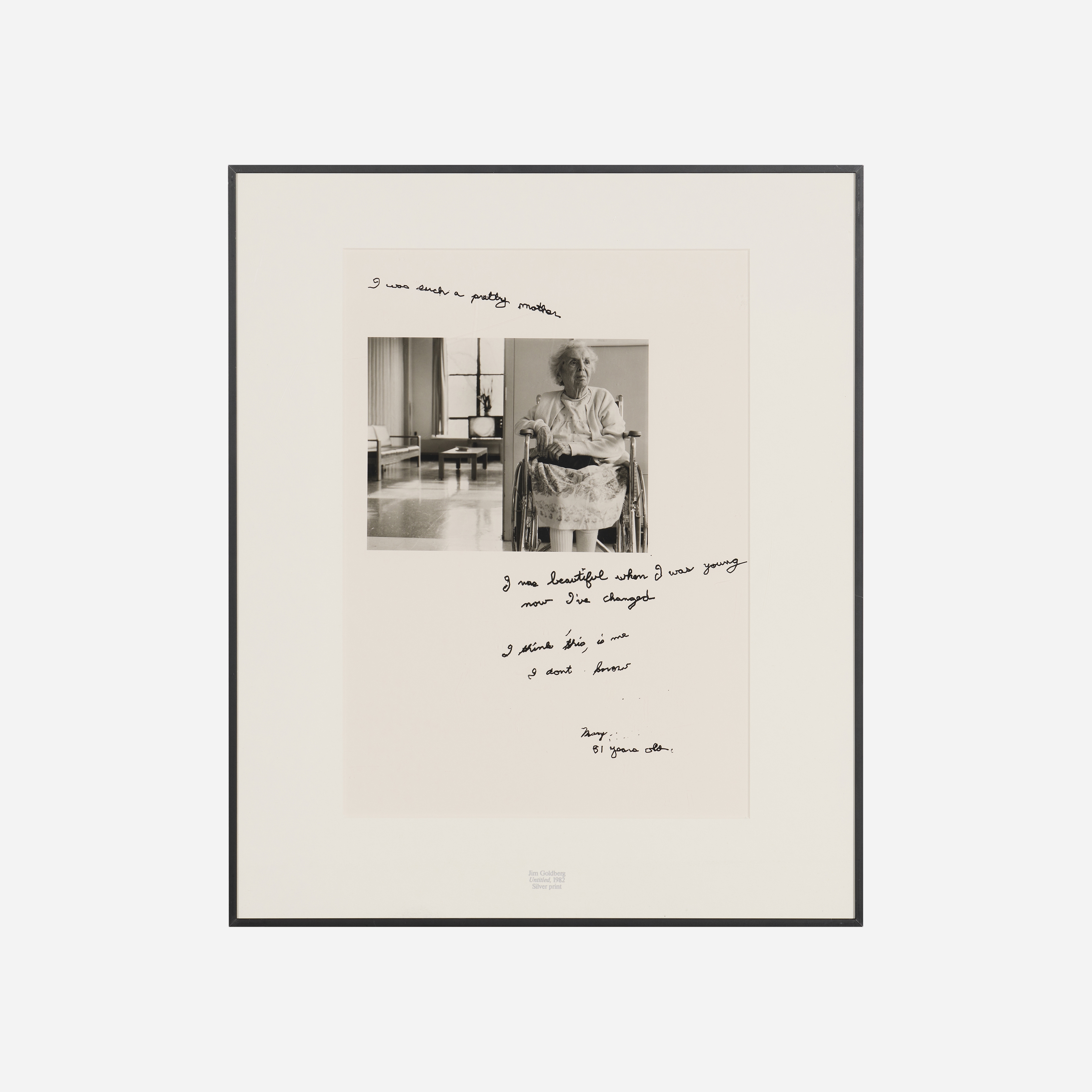 A black-and-white portrait of an elderly person seated in a wheelchair, framed by handwritten text.
