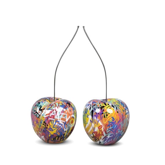 A PAIR OF BULL & STEIN GRAFFITI CHERRY FIBERGLASS GARDEN SCULPTURES