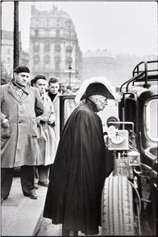 A member of the French Academy on his way to a ceremony at Notre Dame, 1953 - Henri Cartier-Bresson