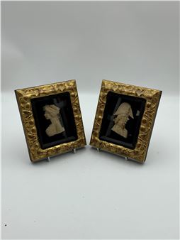 A pair of small wax reliefs of figures in profile