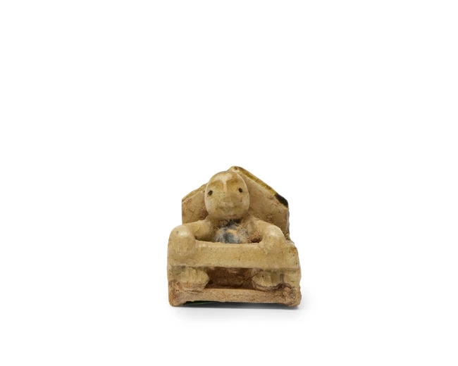 Artwork by Chinese School, A Chinese glazed stoneware miniature model of a boy, Made of Glazed Stoneware
