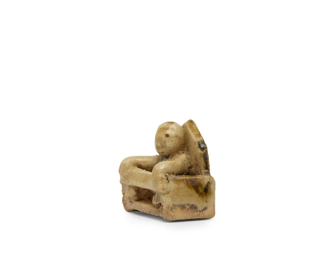 Artwork by Chinese School, A Chinese glazed stoneware miniature model of a boy, Made of Glazed Stoneware