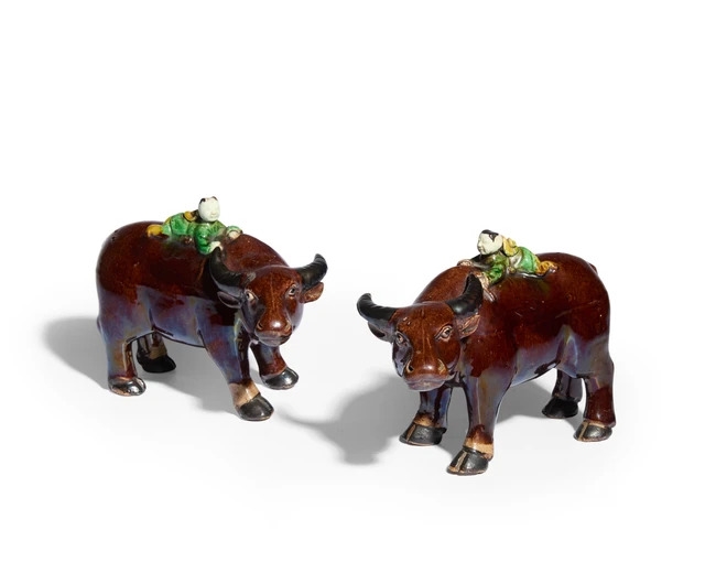 Artwork by Chinese School, A pair of Chinese famille verte biscuit figures of a boy on a buffalo, Made of Biscuit